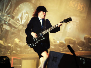 "Angus Young, Barcelona Spain, 2009" by Edvill is licensed under CC BY 2.0.
